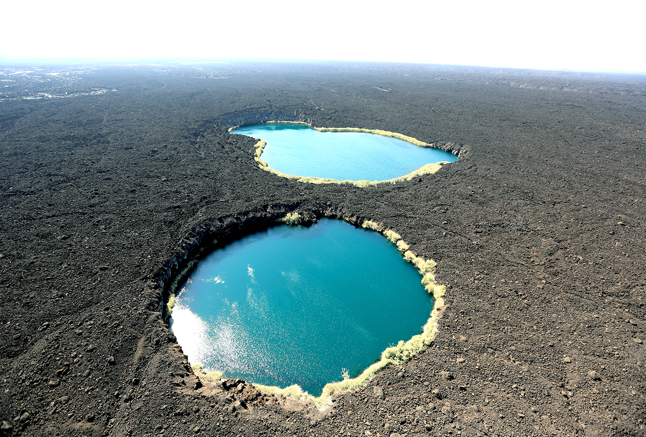 Saline pools, filtered by the lava rock in the Danakil Tropicair